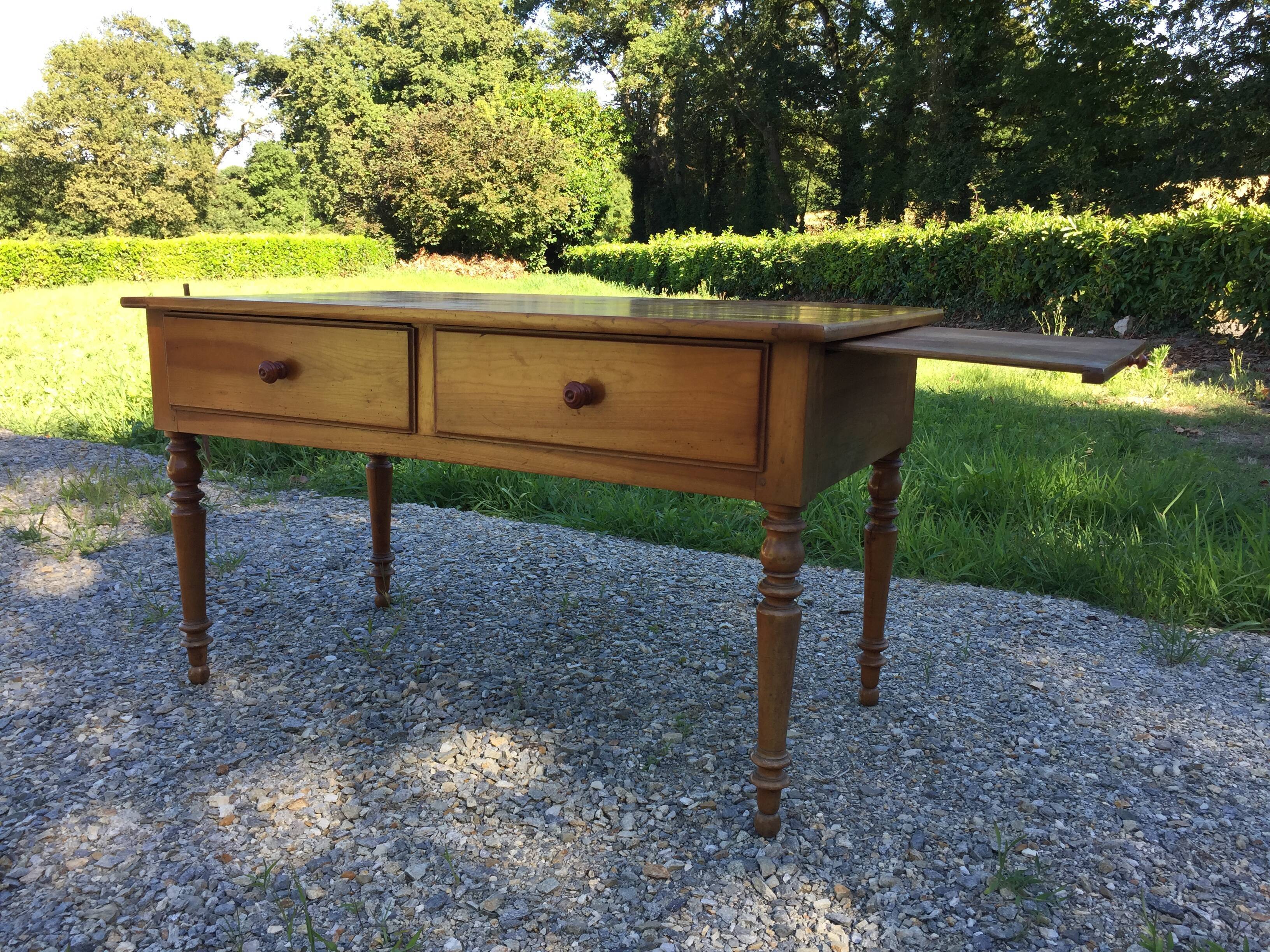 Old farmhouse table louis Philippe style in solid cherry with turned feet.