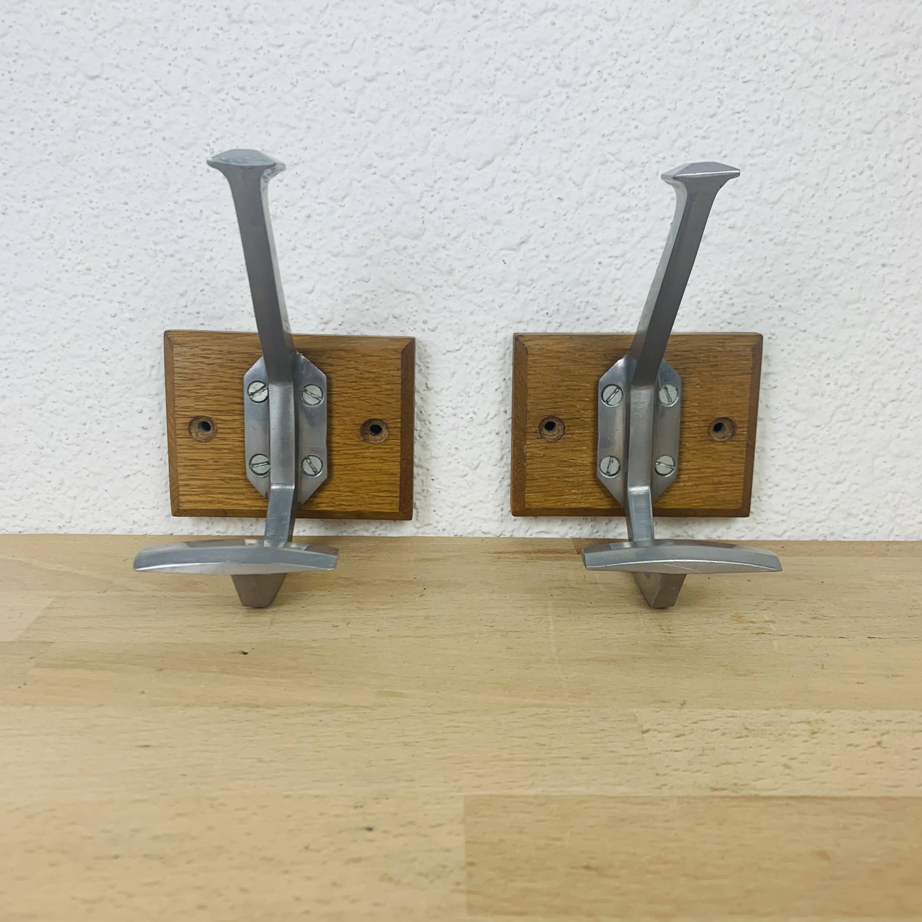 Pair of vintage aluminum coat hooks