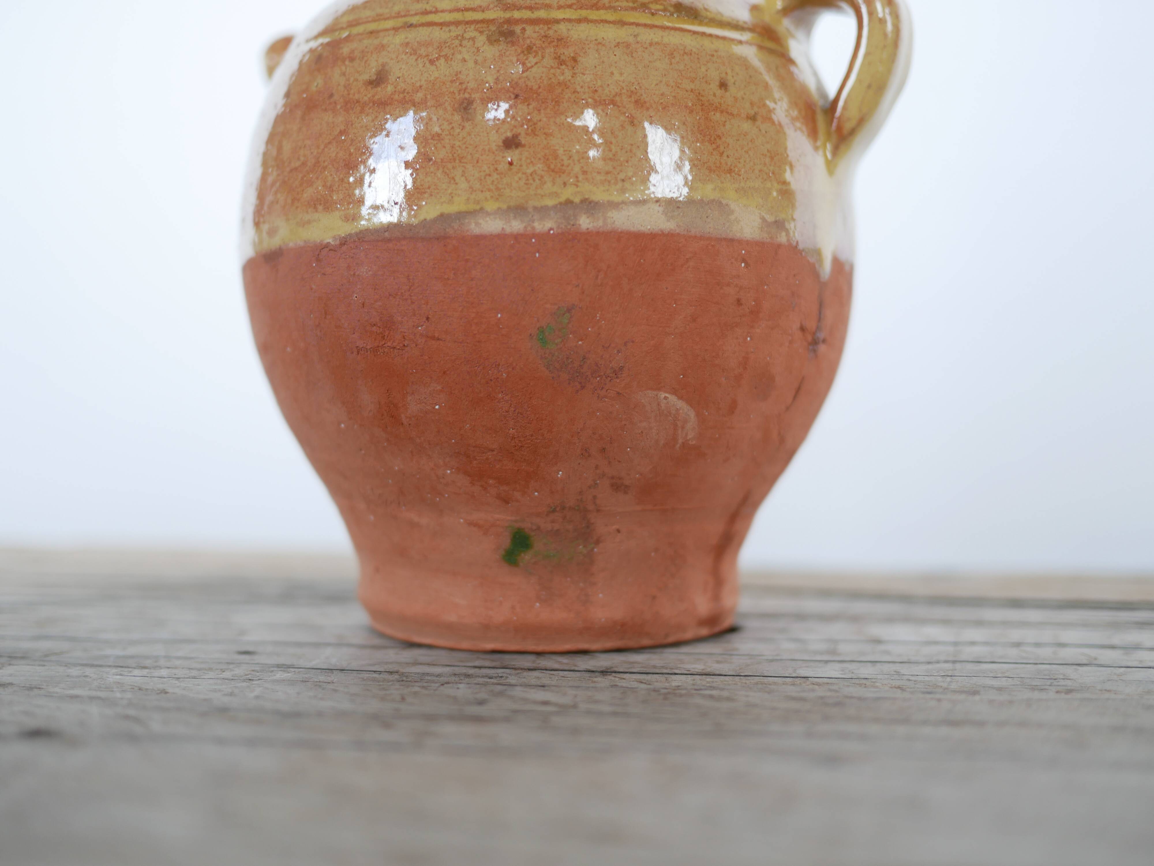 Old gargoulette pot in glazed terracotta