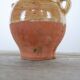 Old gargoulette pot in glazed terracotta