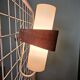 Louis kalff (1897-1976) for philips, pair of nx40 wall lights in wood, opaline glass, and lacquered metal,