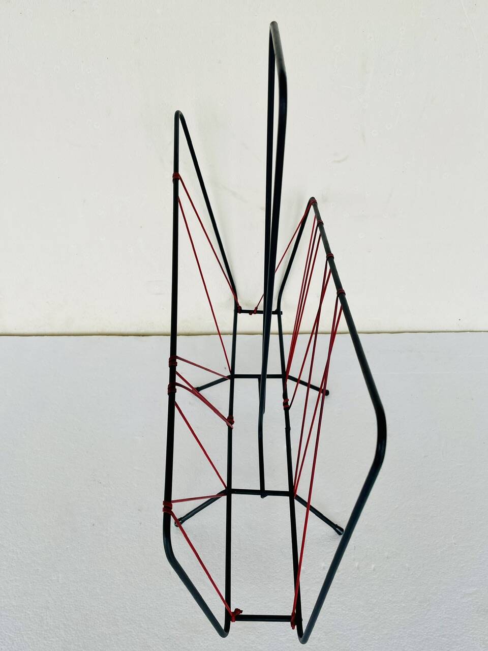 Vintage black metal magazine rack circa 19