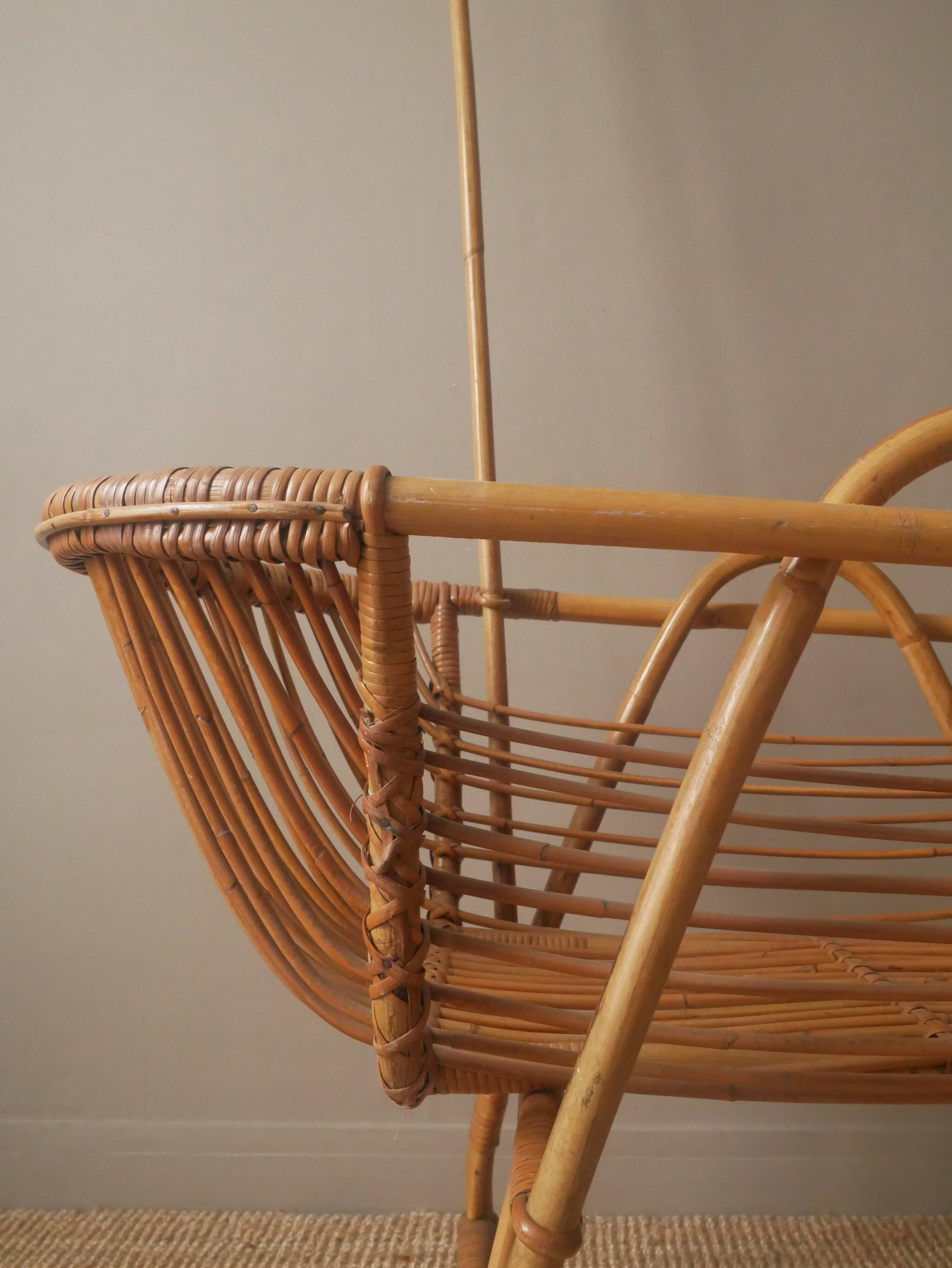 Vintage rattan cradle bassinet on wheels retro Scandinavian design baby bed