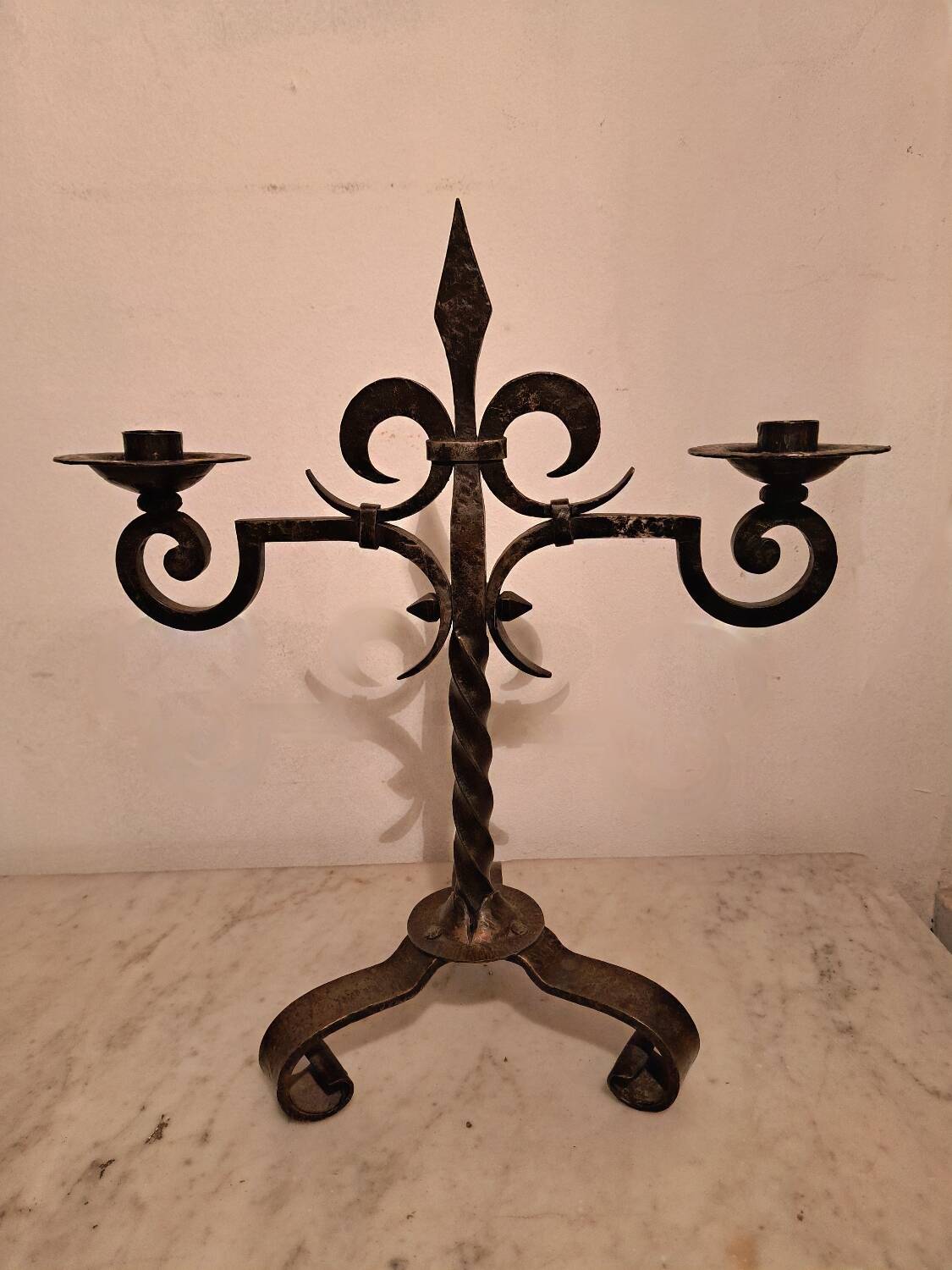 Black wrought iron fleur-de-lis candlestick