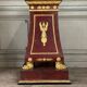 Pair of plaster bases imitating porphyry and gilded bronze circa 1980.