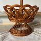 Wicker fruit bowl on a stand