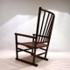 Fauteuil Manou en rotin et assise en cuir, 1960