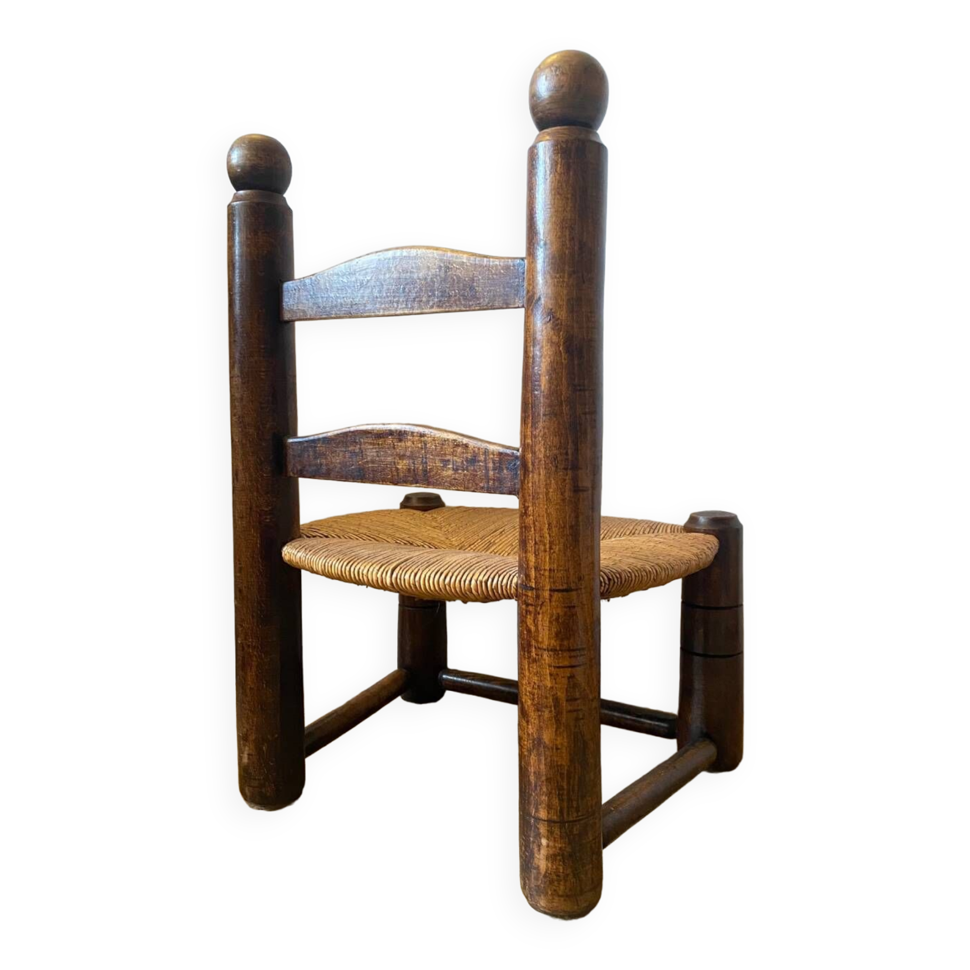 Low brutalist straw chair called fireplace chair