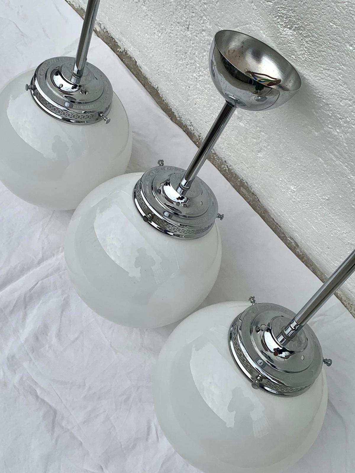 Glass and aluminum globe hanging lamp