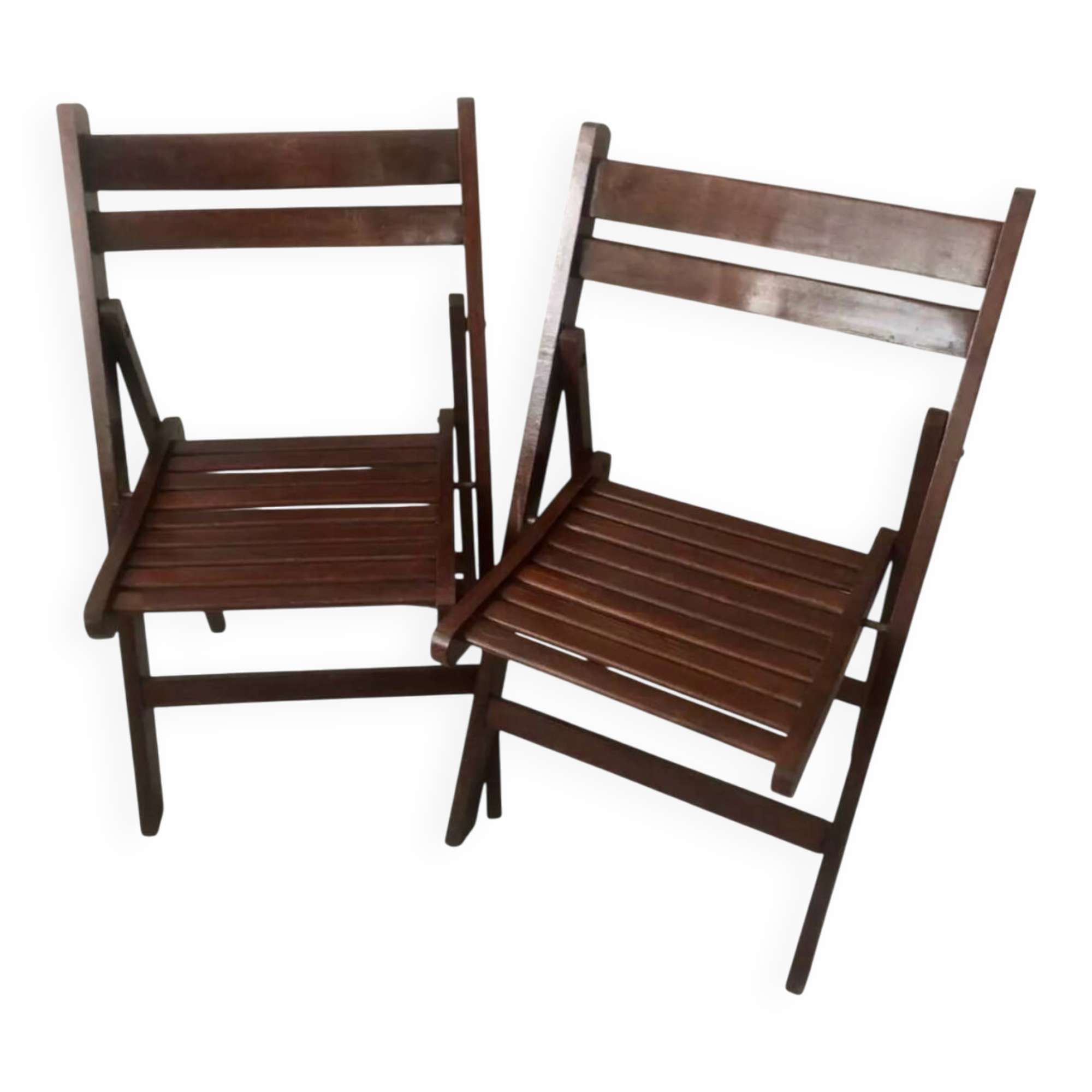 Pair of folding chairs made of dark wood slats.