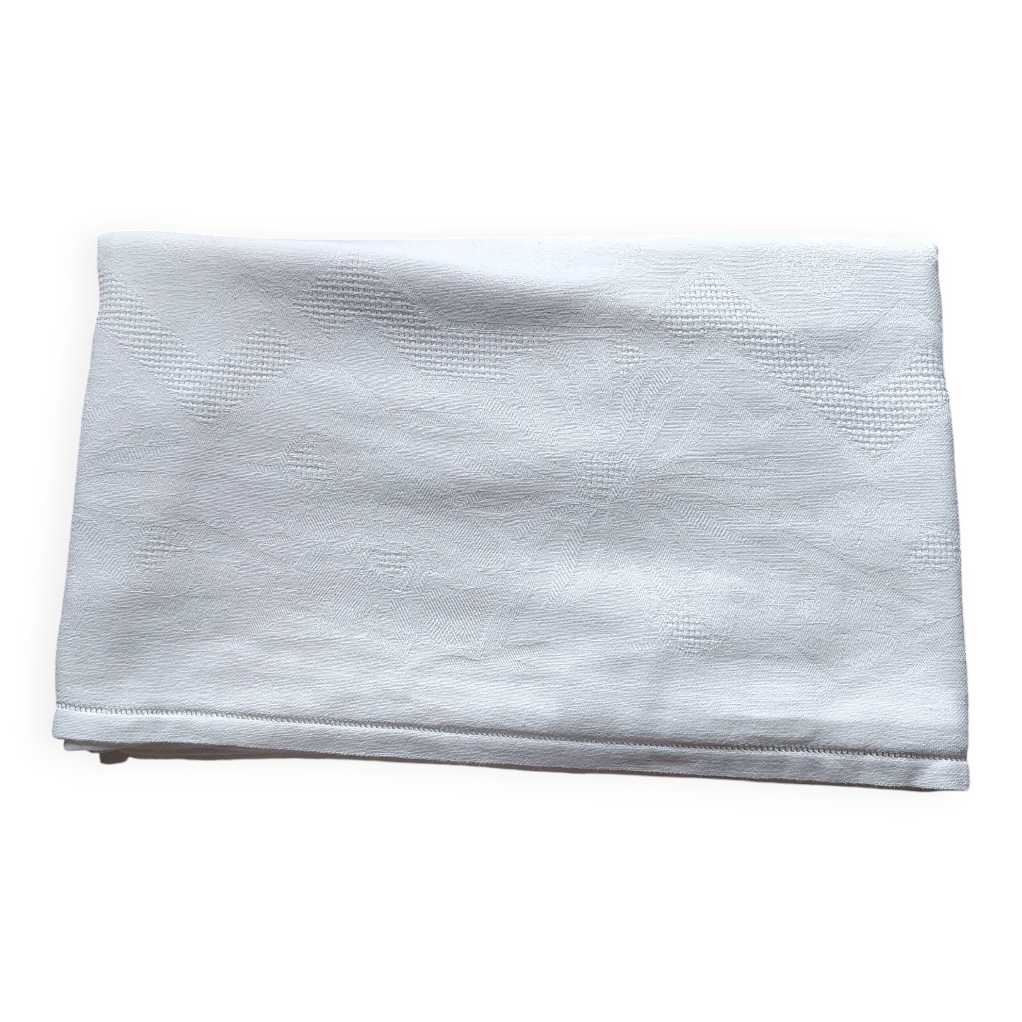 Old white damask cotton tablecloth