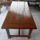 Large rectangular dining table in solid oak in a neo-rustic style.
