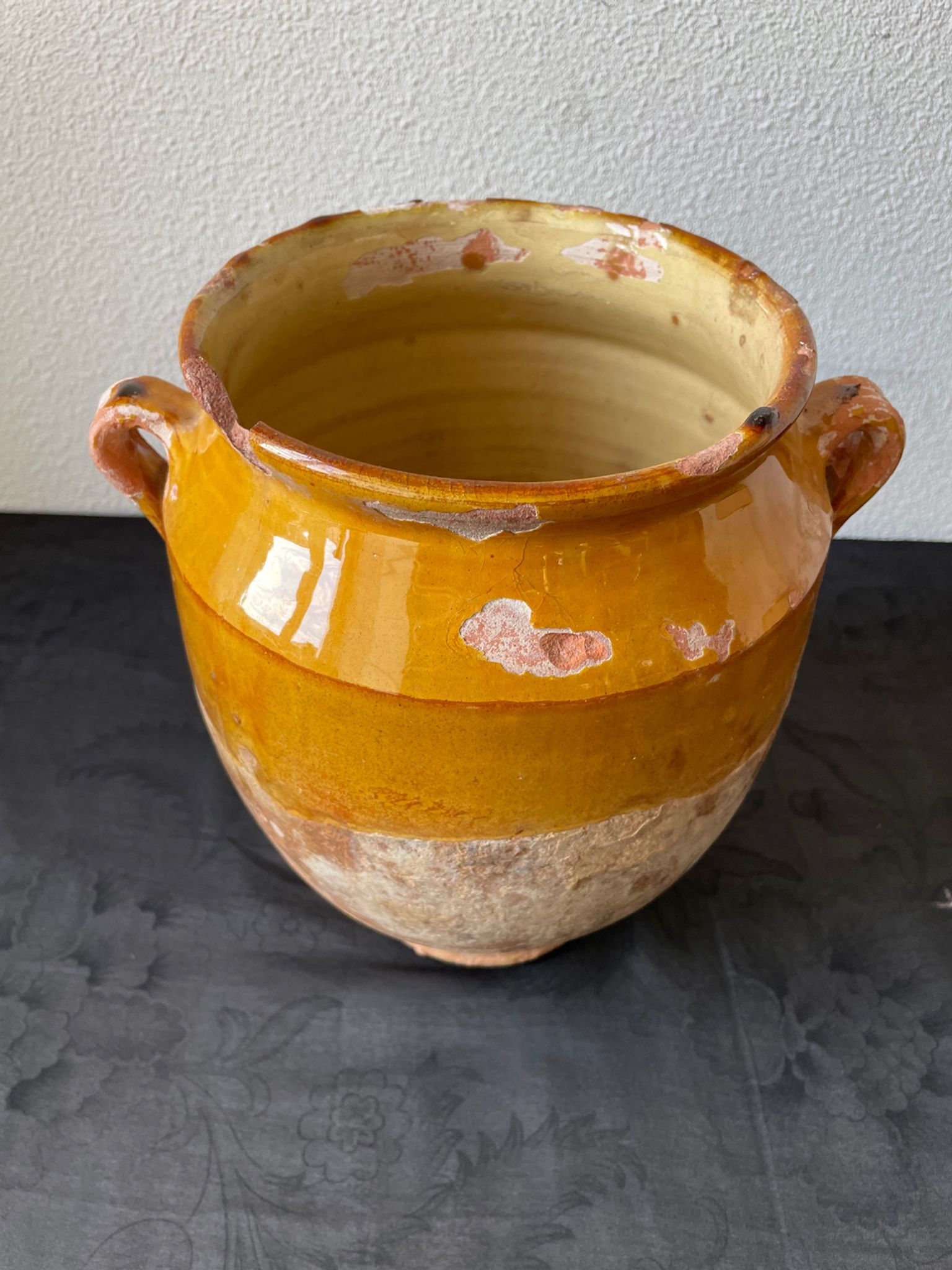 Old grease pot in glazed yellow terracotta, France nineteenth century