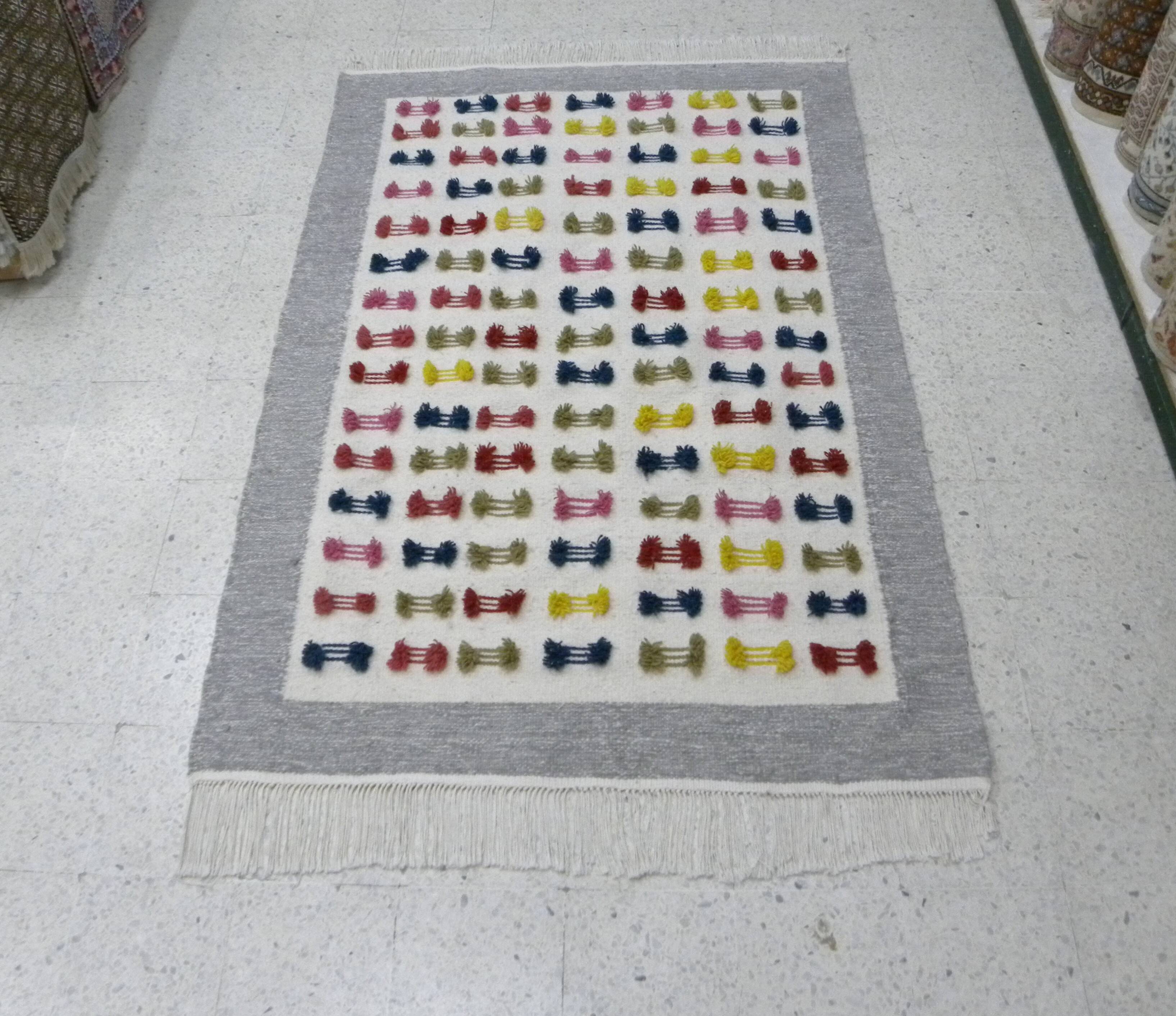 Handwoven Modern Boho Wool Rug with Colourful Patterns and Pompoms