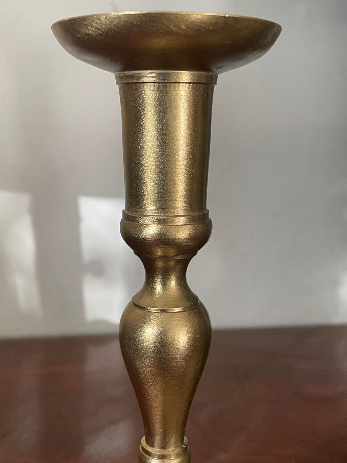 Pair of brushed brass candle holders