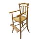 Antique bamboo caned baby chair from the early 20th century.