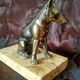 Greenhouse book dog sculpture regulates on marble slab