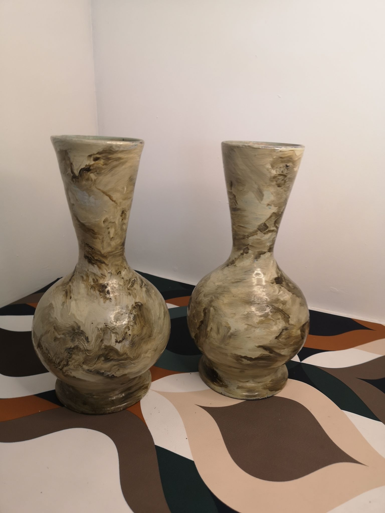 Pair of hand-painted terracotta vases