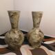 Pair of hand-painted terracotta vases