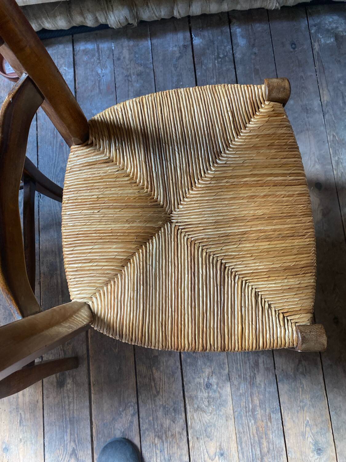 2 wooden chairs with cane