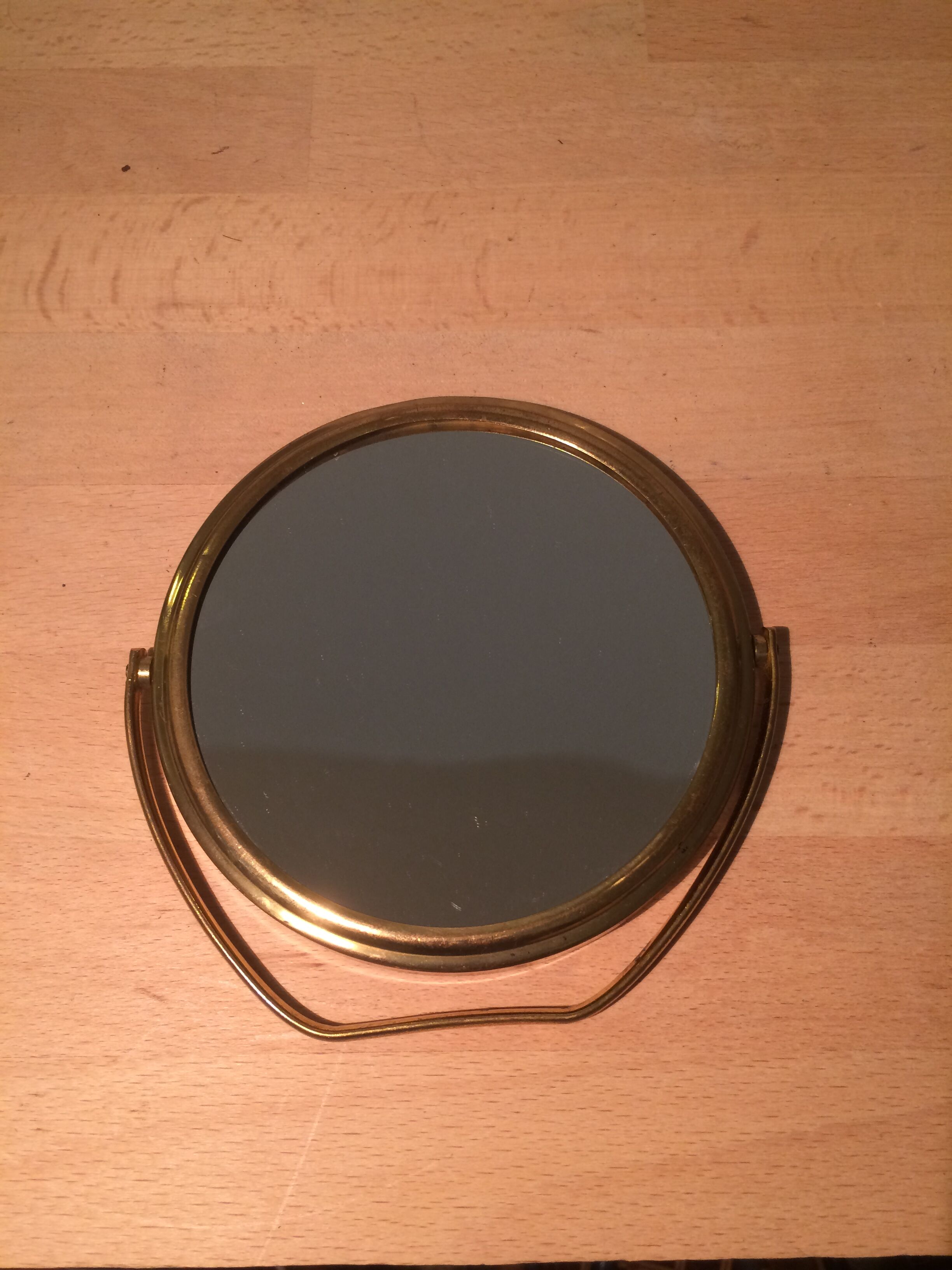 Vintage magnifiing gold round barber mirror