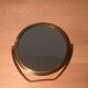 Vintage magnifiing gold round barber mirror