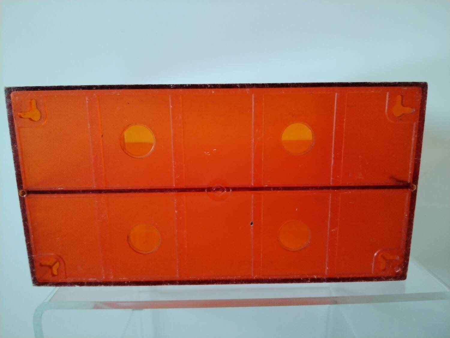 Vinyl magazine holder in orange plexiglass