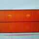 Vinyl magazine holder in orange plexiglass