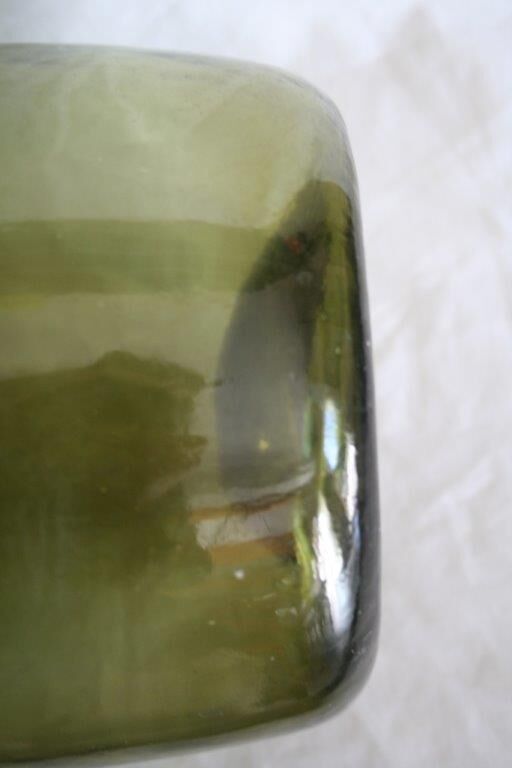 Blown green demijohn