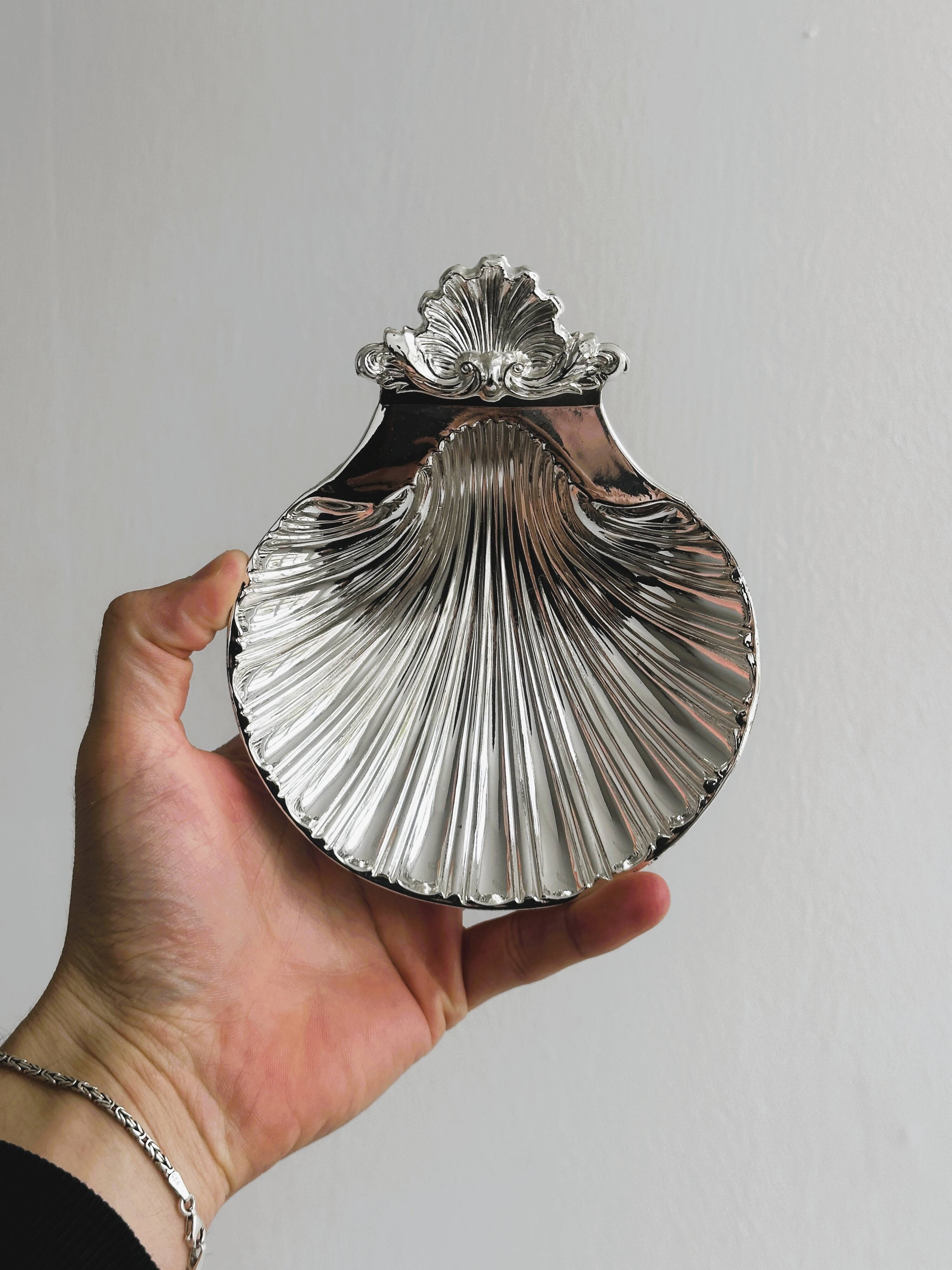 soap dish or jewelry holder in shiny metal