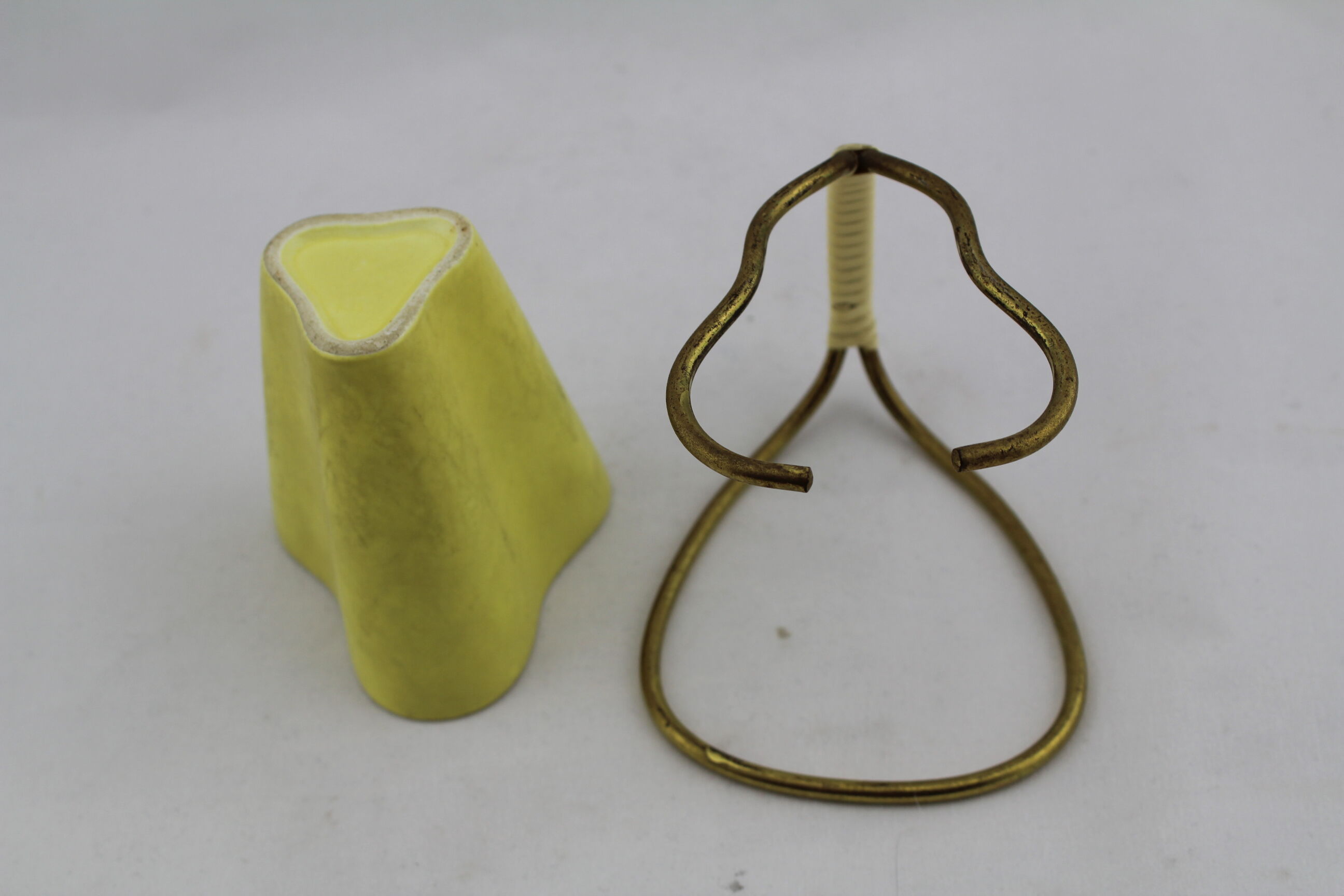 Vase or ceramic pot on foot brass