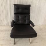 Grained leather armchair with rocking movement