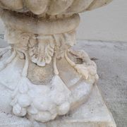 Pair of planter vases decorated with faces in reconstituted stone 1950s