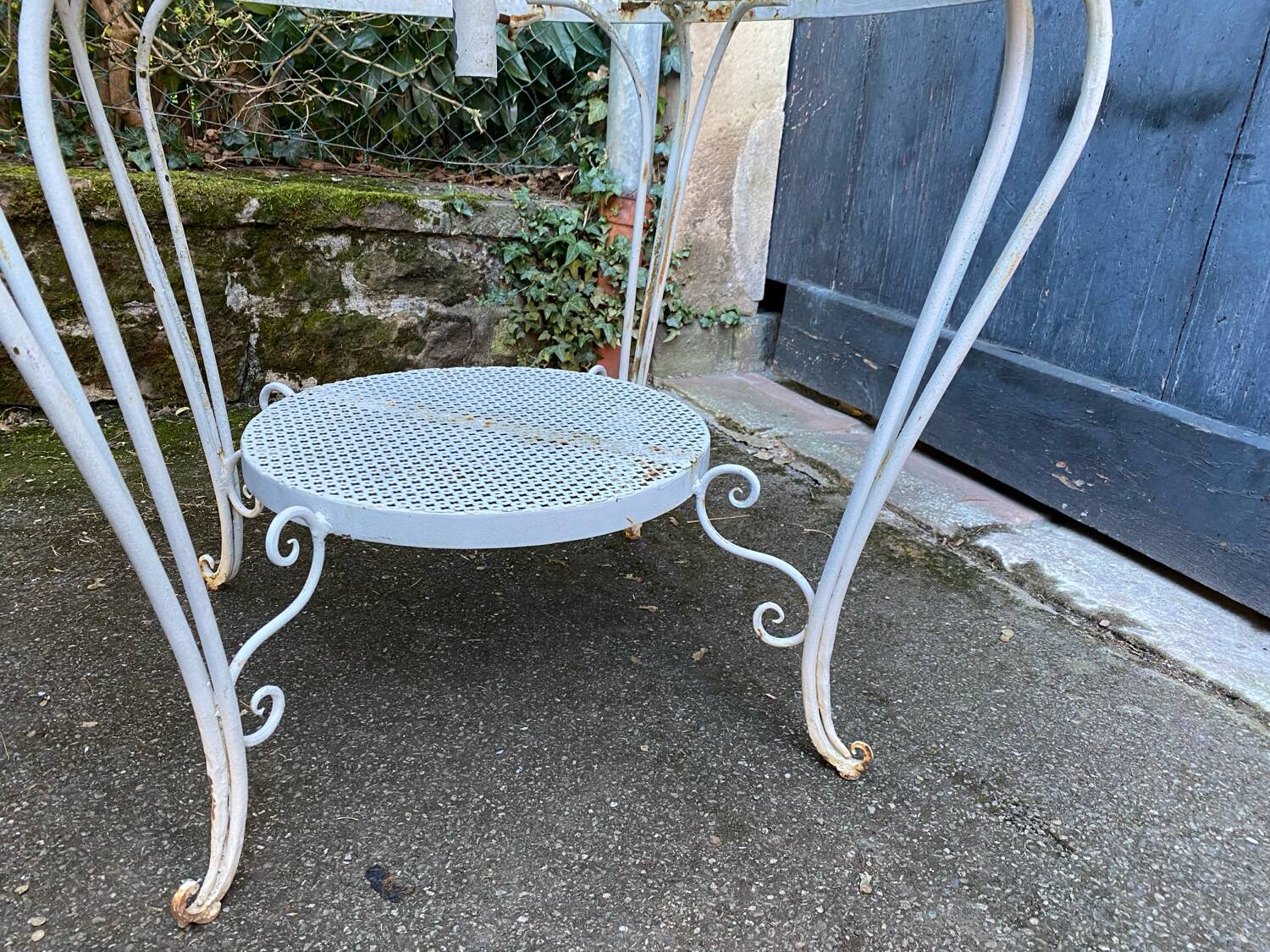 White lacquered perforated metal garden table circa 1950