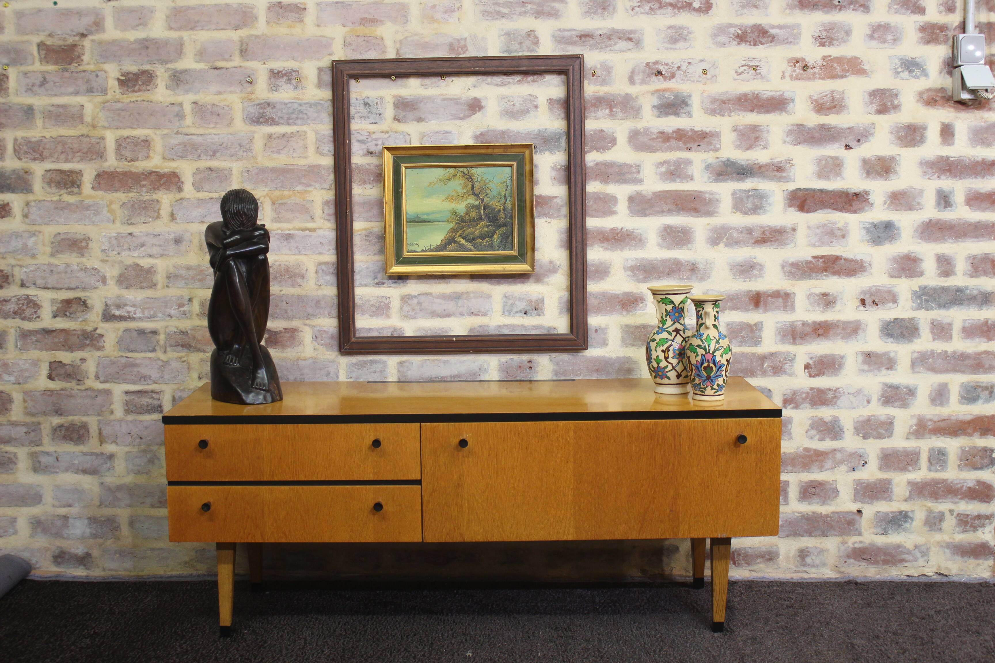 Black-gloved 50s varnished wooden sideboard