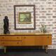 Black-gloved 50s varnished wooden sideboard