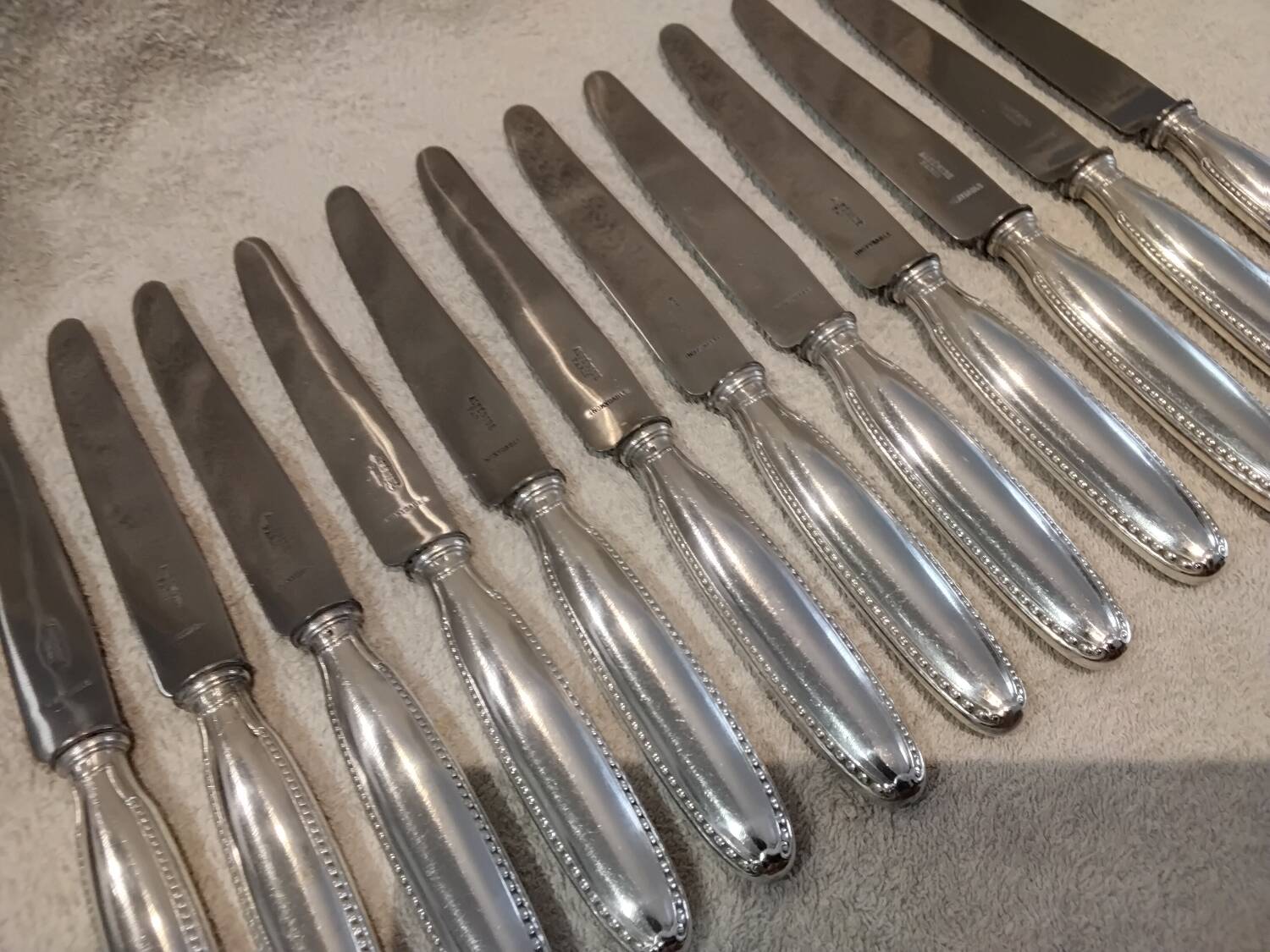 12 silver plated table knives, goldsmith Alfenide st LXVI pearls