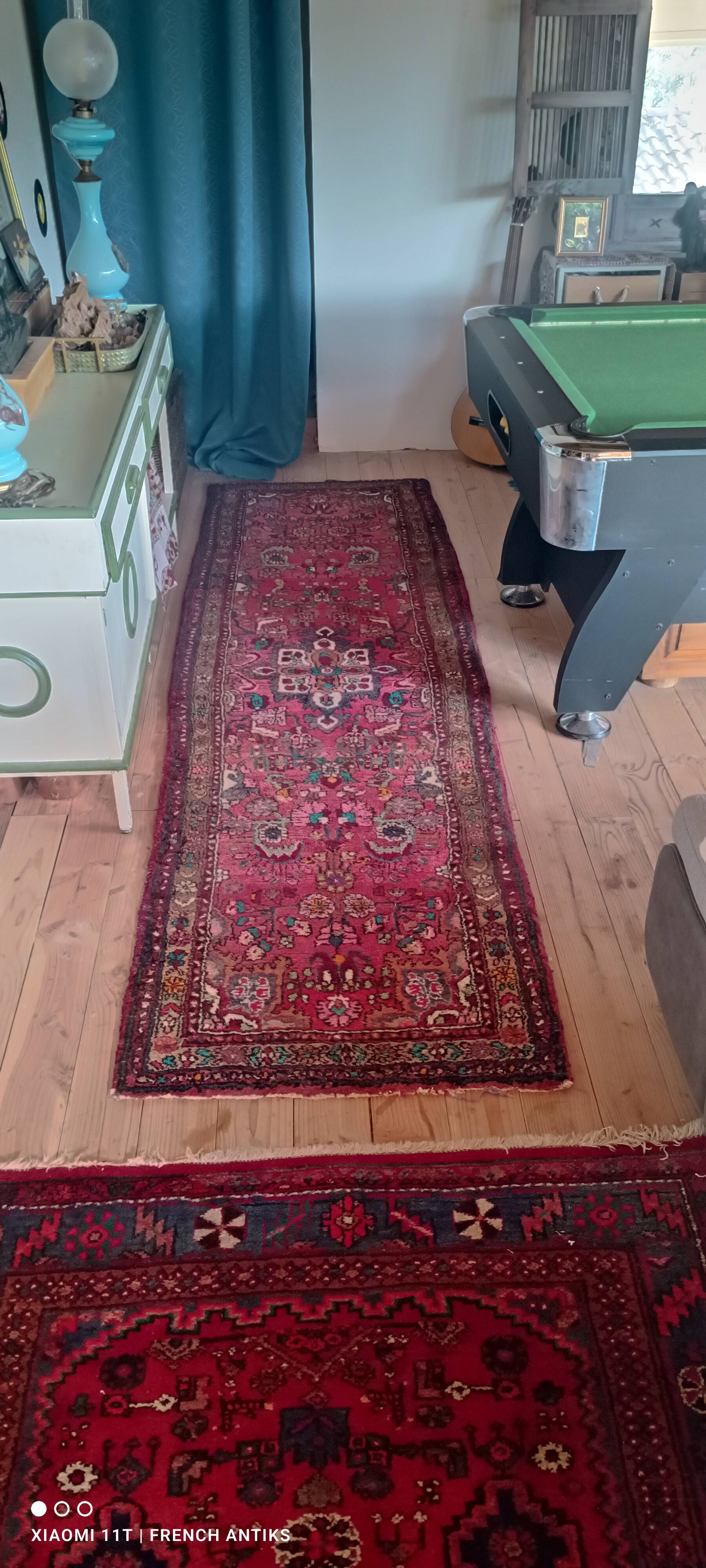 Vintage oriental rug from the 1930s. Handcrafted, handmade. Worn.