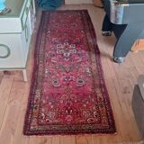 Vintage oriental rug from the 1930s. Handcrafted, handmade. Worn.