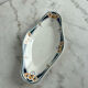 Longwy ramekin with blue and orange floral decoration.