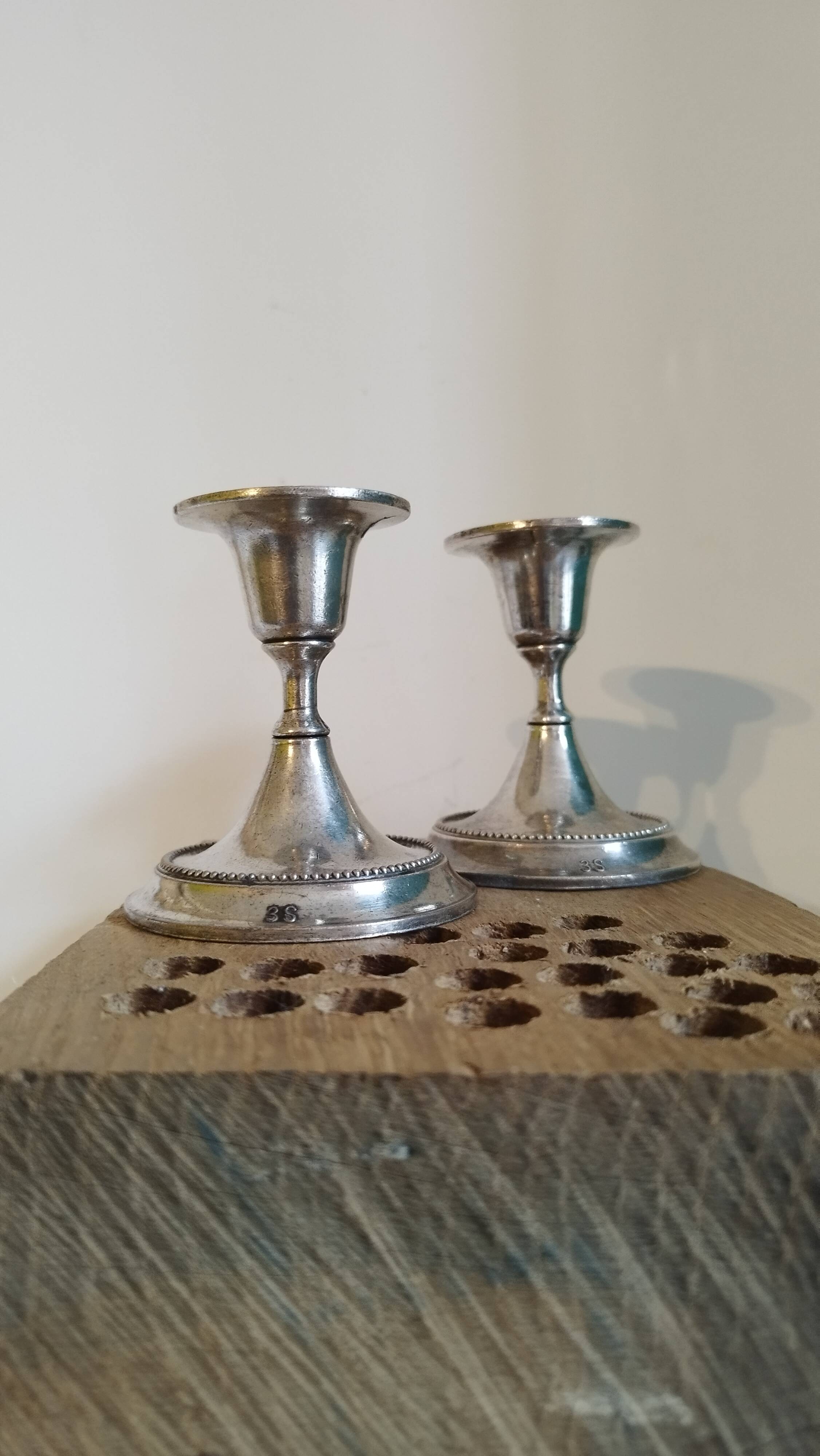 2 small silver metal candle holders