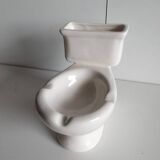 Atypical ashtray in the shape of a toilet