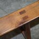 Pair of antique Victorian trestle benches in fruitwood.