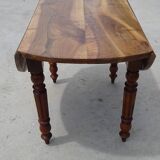 Round drop-leaf table made entirely of solid walnut