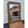 19th-century fireplace mirror in gilded wood and stucco.