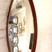 Oval hall mirror, wooden frame. Scandinavia 1960s 33x100cm