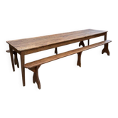 Large early 20th-century tavern table and its two benches.