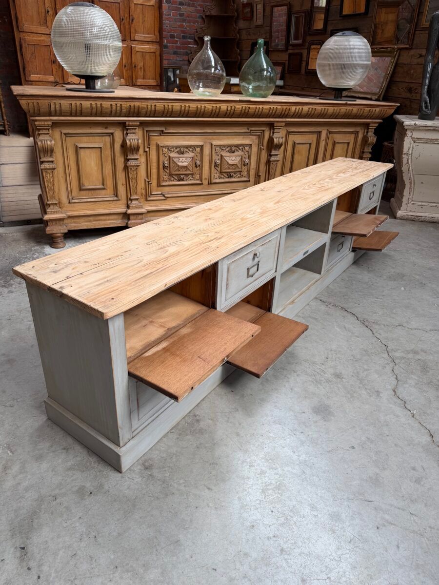 Old workshop furniture transformed into a TV unit.