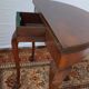 A half-moon english mahogany games table
