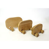 Ensemble de trois éléphants en bois à roulette